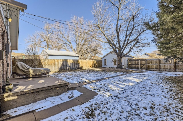 view of yard covered in snow