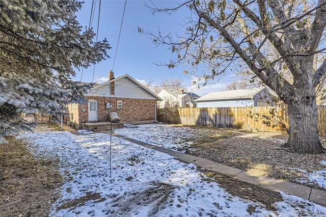 view of snow covered house