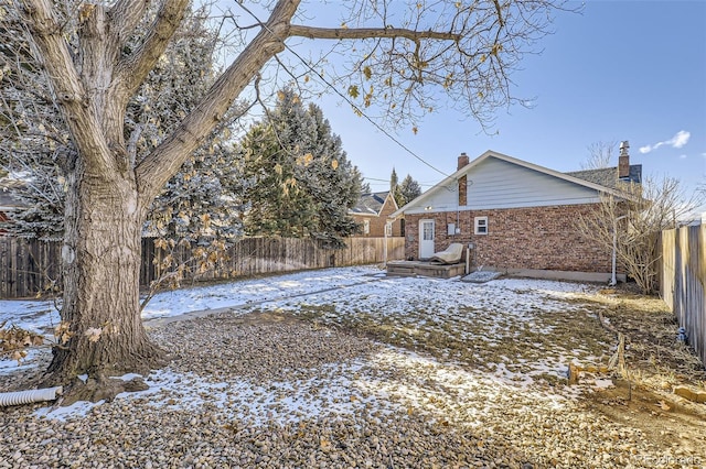 view of yard layered in snow