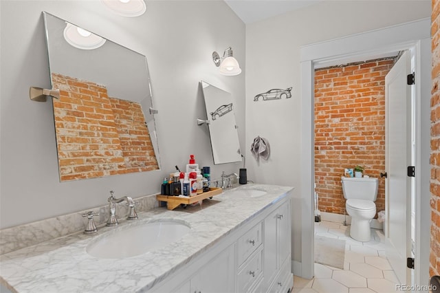 bathroom with tile patterned flooring, vanity, and toilet