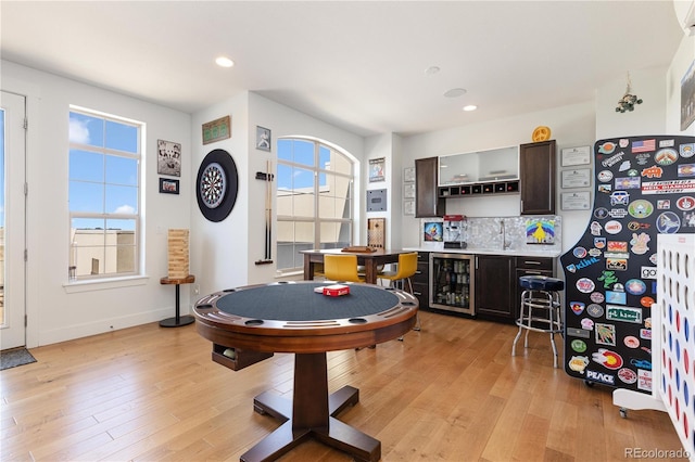 9158 Martin Luther King Blvd, Denver, CO 80238 - rec room featuring beverage cooler, wet bar, light wood-style floors, and recessed lighting