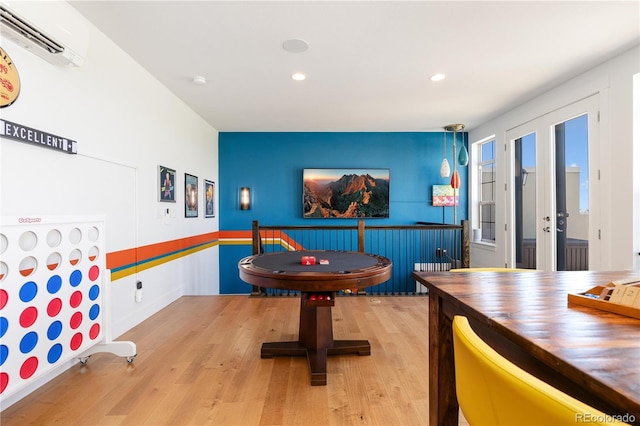 9158 Martin Luther King Blvd, Denver, CO 80238 - game room with a wall unit AC, wood finished floors, recessed lighting, and french doors