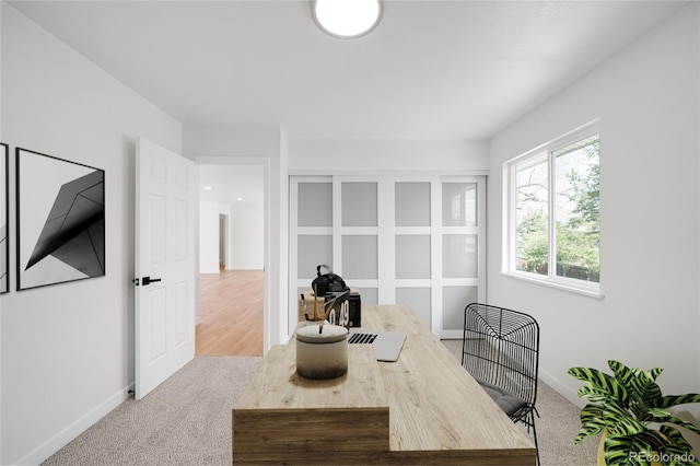 carpeted office with baseboards