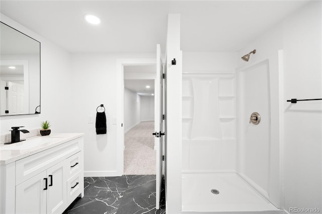 full bathroom with recessed lighting, a shower stall, marble finish floor, vanity, and baseboards