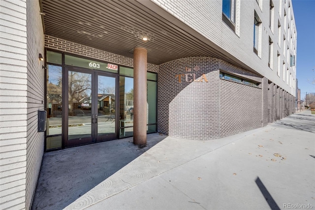 entrance to property featuring french doors