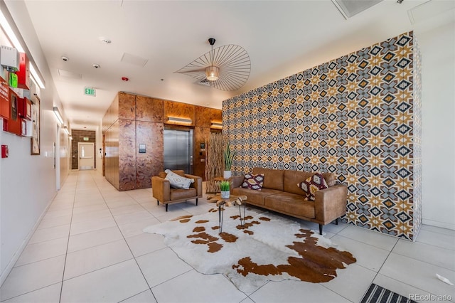 living room featuring elevator and light tile patterned floors