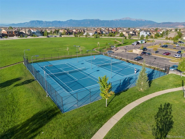 aerial view of residential area featuring a mountainous background