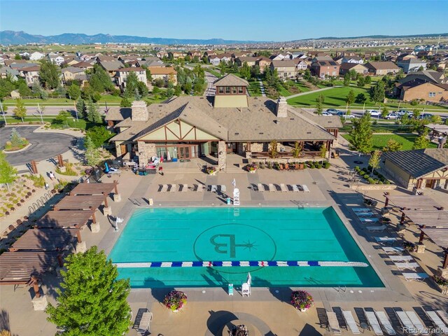 6712 Golden Briar Ln, Colorado Springs, CO 80927 - aerial perspective of suburban area featuring a pool and a mountainous background