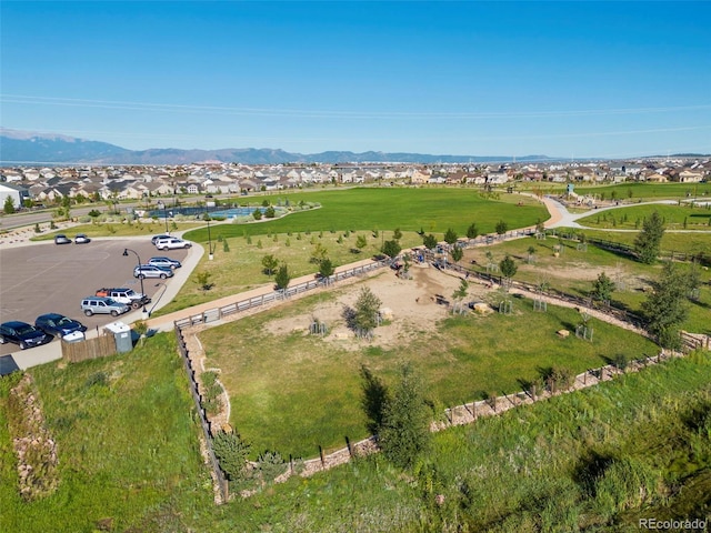 aerial view of property's location with nearby suburban area and a mountain backdrop