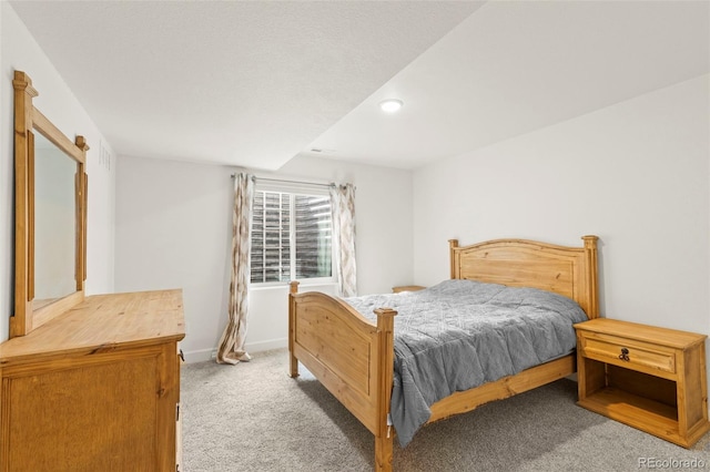 carpeted bedroom featuring recessed lighting and baseboards