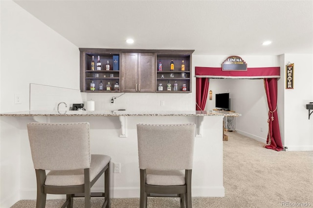 bar featuring backsplash, light colored carpet, recessed lighting, and baseboards