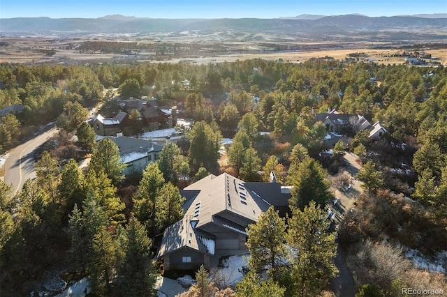 birds eye view of property featuring a mountain view