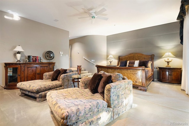 bedroom featuring ceiling fan and light colored carpet