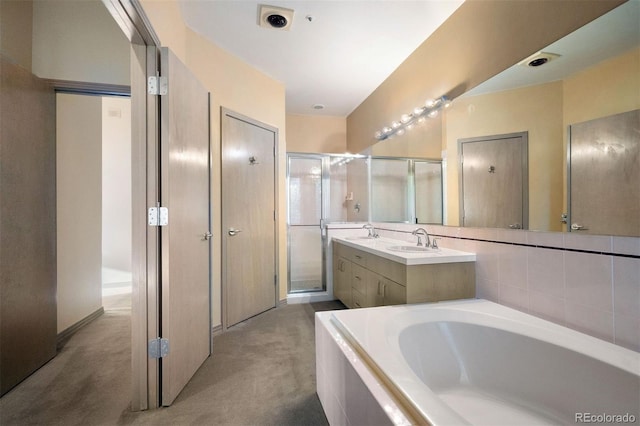 full bathroom with a garden tub, a shower stall, and vanity