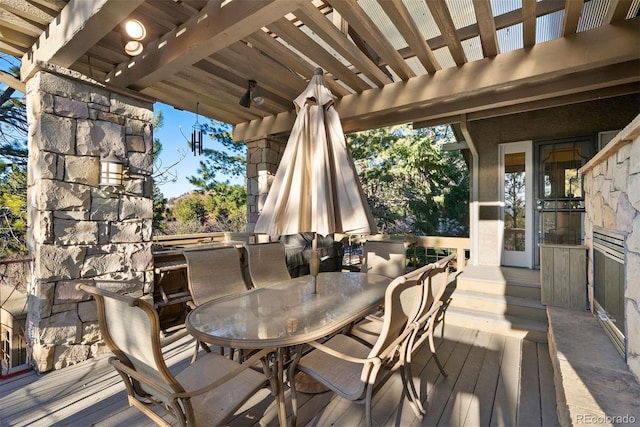 wooden terrace with outdoor dining area