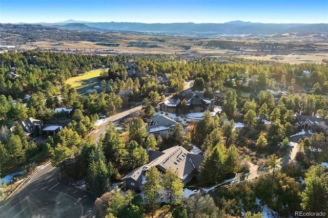 bird's eye view featuring a mountain view and a view of trees