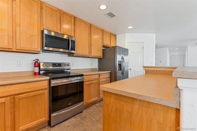 5798 Biscay St, Denver, CO 80249 - kitchen featuring appliances with stainless steel finishes, light countertops, and recessed lighting