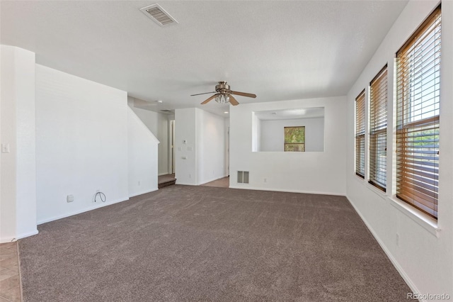 5798 Biscay St, Denver, CO 80249 - empty room featuring carpet flooring, a ceiling fan, and baseboards