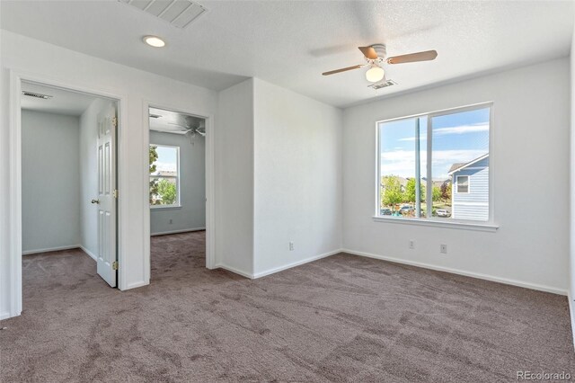 5798 Biscay St, Denver, CO 80249 - carpeted spare room with ceiling fan and baseboards
