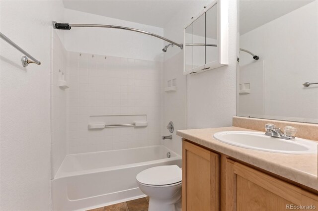 5798 Biscay St, Denver, CO 80249 - bathroom featuring toilet, washtub / shower combination, vanity, and tile patterned floors