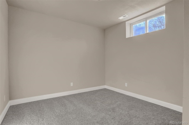 unfurnished room featuring carpet floors