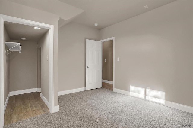 unfurnished bedroom with carpet and a closet