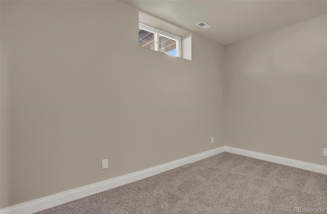 empty room with carpet flooring