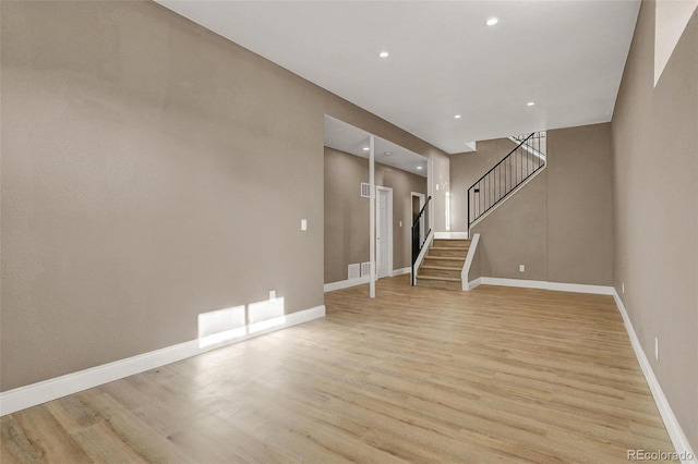 unfurnished living room with light wood-type flooring