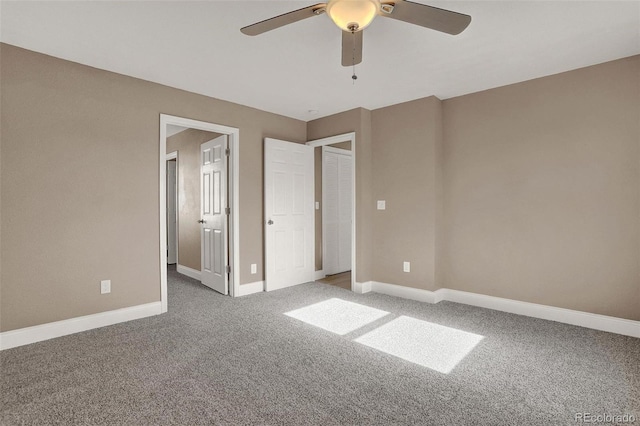 unfurnished bedroom with carpet floors and ceiling fan