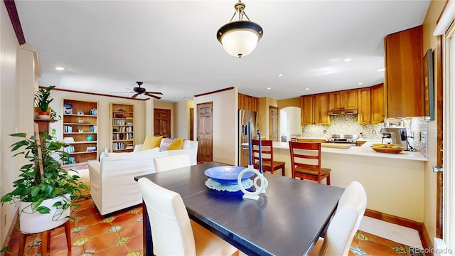 dining room featuring a ceiling fan, recessed lighting, light tile patterned floors, and arched walkways