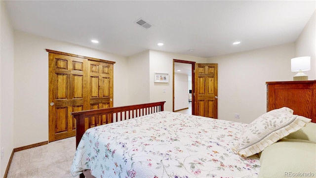 bedroom featuring light carpet, recessed lighting, and baseboards