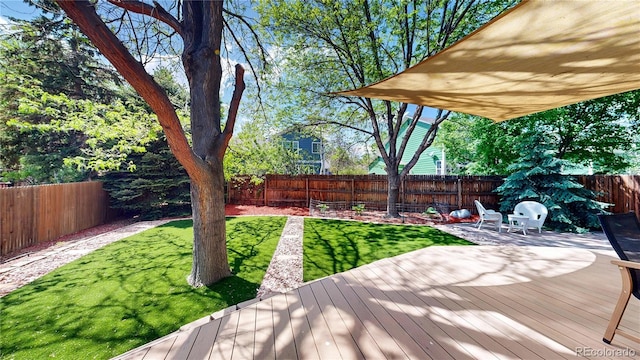 view of yard featuring a wooden deck