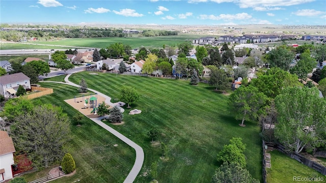 aerial view of property and surrounding area with nearby suburban area