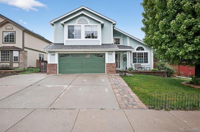 7330 Cotton Dr, Colorado Springs, CO 80923 - view of front of home with brick siding, concrete driveway, and a garage
