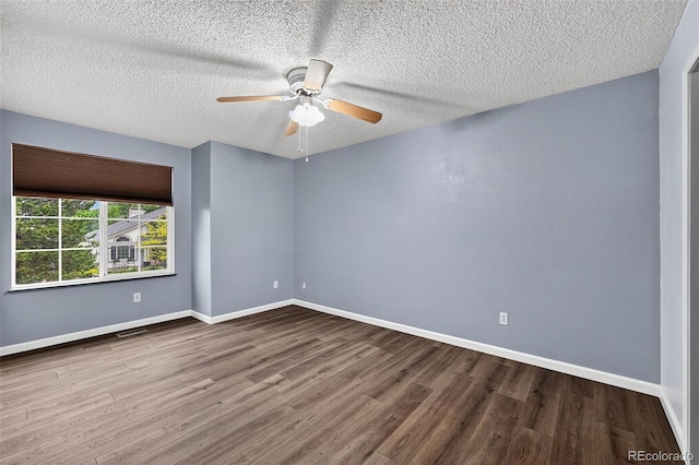 7330 Cotton Dr, Colorado Springs, CO 80923 - unfurnished room with wood finished floors, a ceiling fan, baseboards, and a textured ceiling