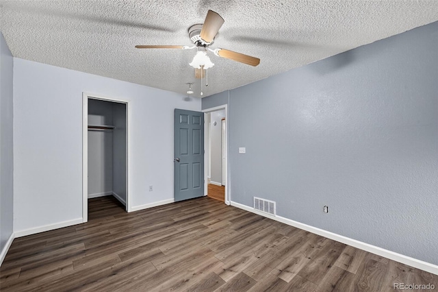 7330 Cotton Dr, Colorado Springs, CO 80923 - unfurnished bedroom with wood finished floors, a closet, baseboards, a textured ceiling, and a ceiling fan