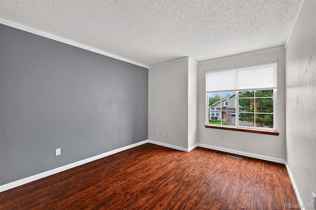 7330 Cotton Dr, Colorado Springs, CO 80923 - spare room featuring wood finished floors, ornamental molding, a textured ceiling, and baseboards