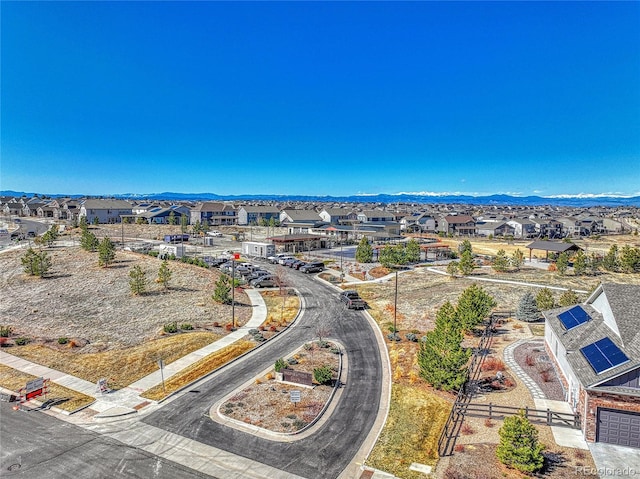 birds eye view of property with a residential view and a mountain view