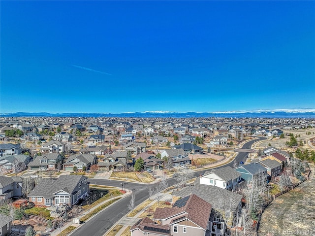 birds eye view of property with a mountain view and a residential view