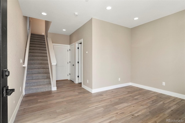 spare room featuring light hardwood / wood-style floors