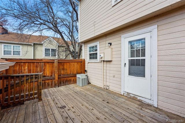 wooden deck with central AC unit