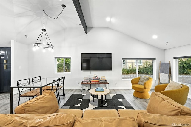 2500 Estes St, Lakewood, CO 80215 - living area with wood finished floors, high vaulted ceiling, recessed lighting, and beam ceiling