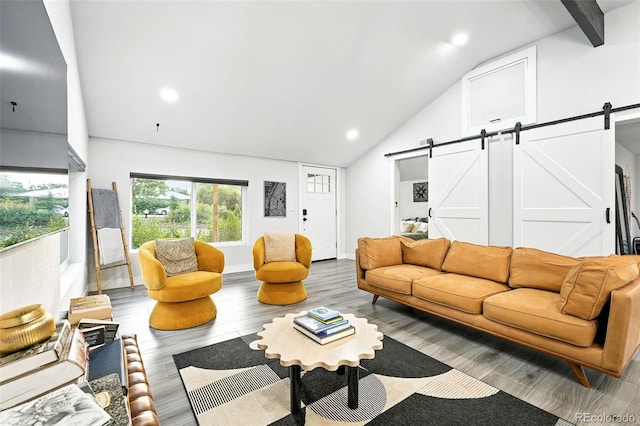 2500 Estes St, Lakewood, CO 80215 - living room with a barn door, wood finished floors, recessed lighting, and high vaulted ceiling