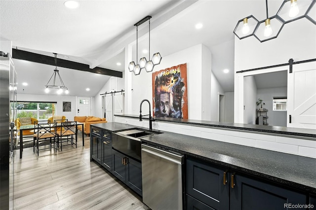 2500 Estes St, Lakewood, CO 80215 - kitchen featuring a barn door, stainless steel appliances, light wood finished floors, hanging light fixtures, and recessed lighting