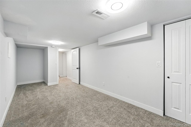 2500 Estes St, Lakewood, CO 80215 - finished below grade area with carpet flooring and a textured ceiling