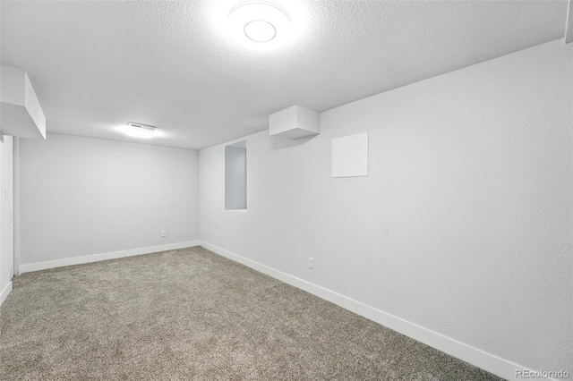 2500 Estes St, Lakewood, CO 80215 - finished basement featuring carpet flooring and a textured ceiling