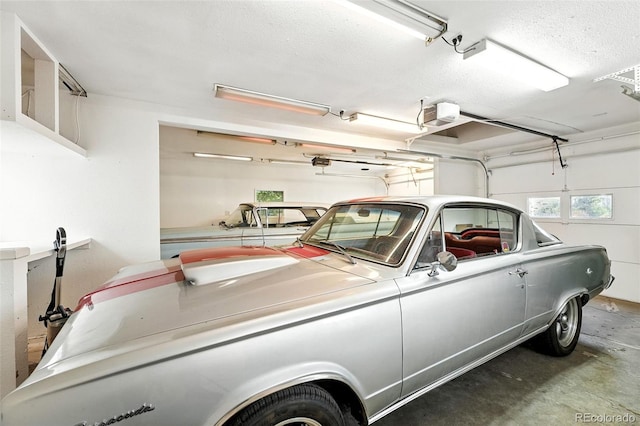 2500 Estes St, Lakewood, CO 80215 - garage featuring a garage door opener