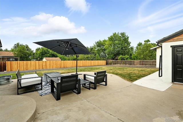 2500 Estes St, Lakewood, CO 80215 - fenced backyard with an outdoor living space and a patio area