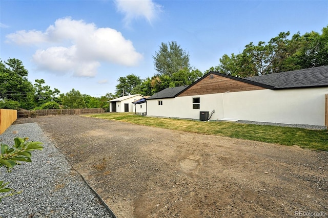 2500 Estes St, Lakewood, CO 80215 - view of side of property with stucco siding and a detached garage