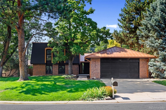 view of front of house with brick siding, concrete driveway, an attached garage, metal roof, and a front lawn